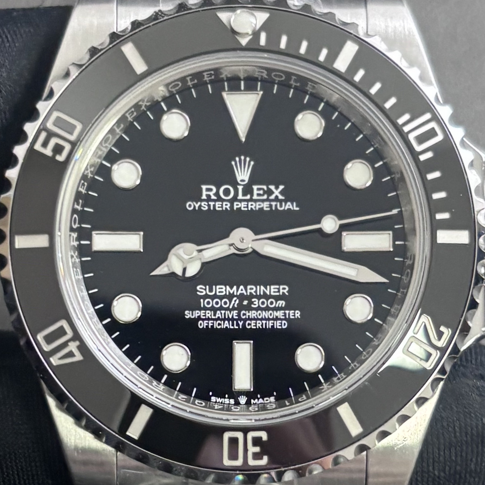 S012 · Camera geometry corrected. Image rotated approximately 6.4° clockwise at the dial centre; perspective and unequal image scaling normalized to a circular dial reference using the printed ticks’ inner tips after broad ink detection. Recentered and resampled to 1900 × 1900 pixels. No correction for crystal refraction or raised bezel/hand geometry. Extended rays are visual dial references only; they do not correct or measure the raised bezel.