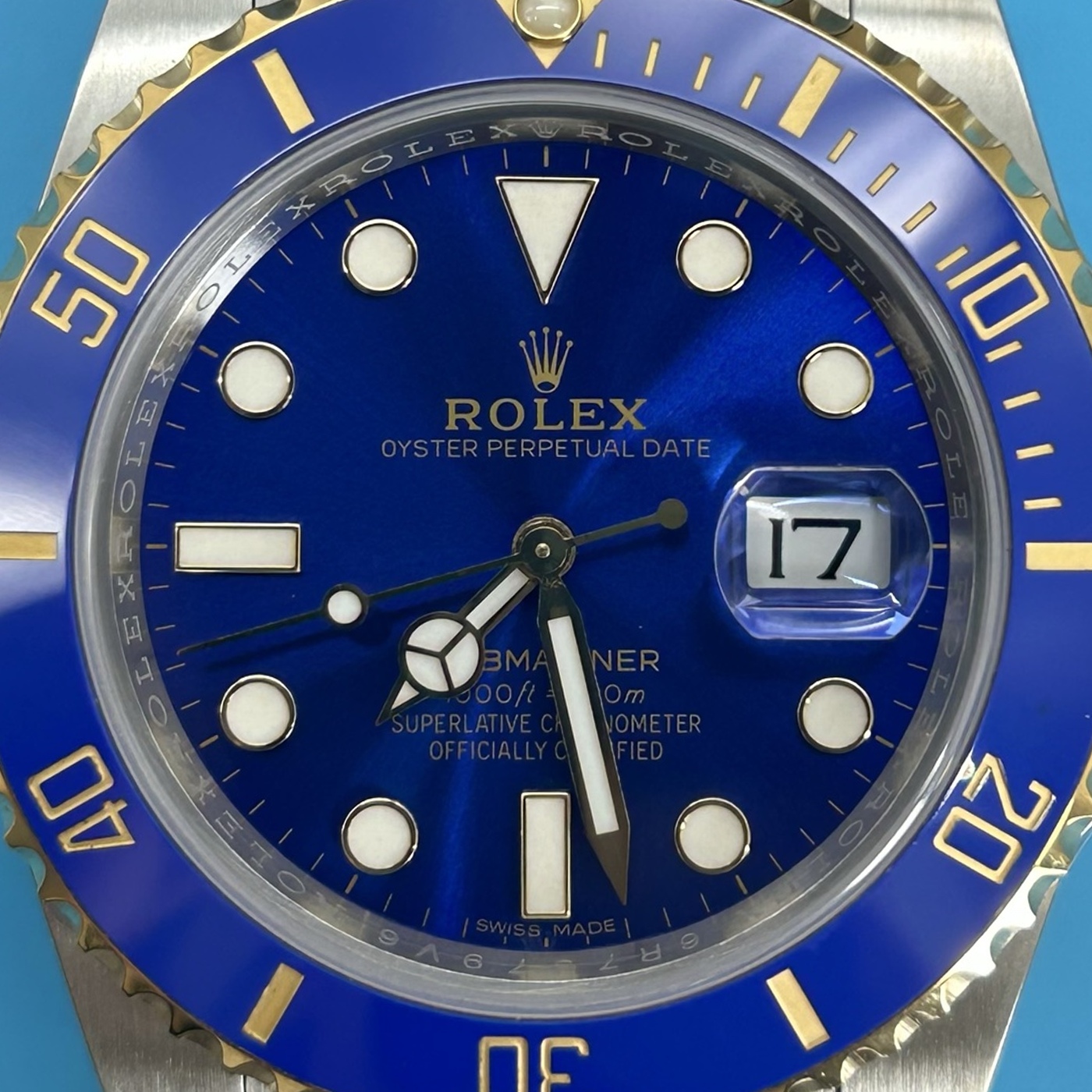 A04 · Camera geometry corrected. Image rotated approximately 0.9° clockwise at the dial centre; perspective and unequal image scaling normalized to a circular dial reference using the saved printed minute-track reference. Recentered and resampled to 1400 × 1400 pixels. No correction for crystal refraction or raised bezel/hand geometry.