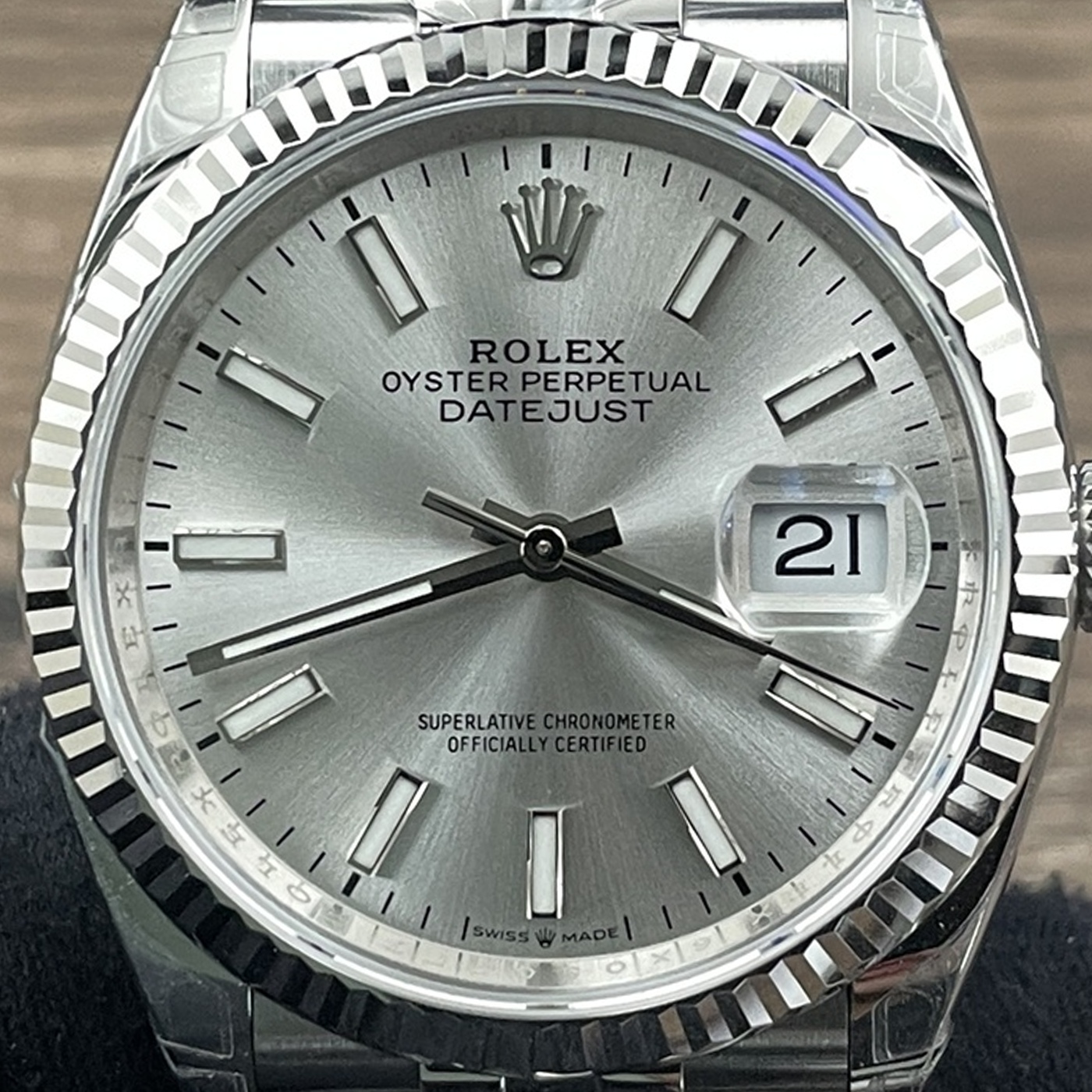 P04 · Camera geometry corrected. Image rotated approximately 1.0° counterclockwise at the dial centre; perspective and unequal image scaling normalized to a circular dial reference using the saved printed minute-track reference. Recentered and resampled to 1400 × 1400 pixels. No correction for crystal refraction or raised bezel/hand geometry.