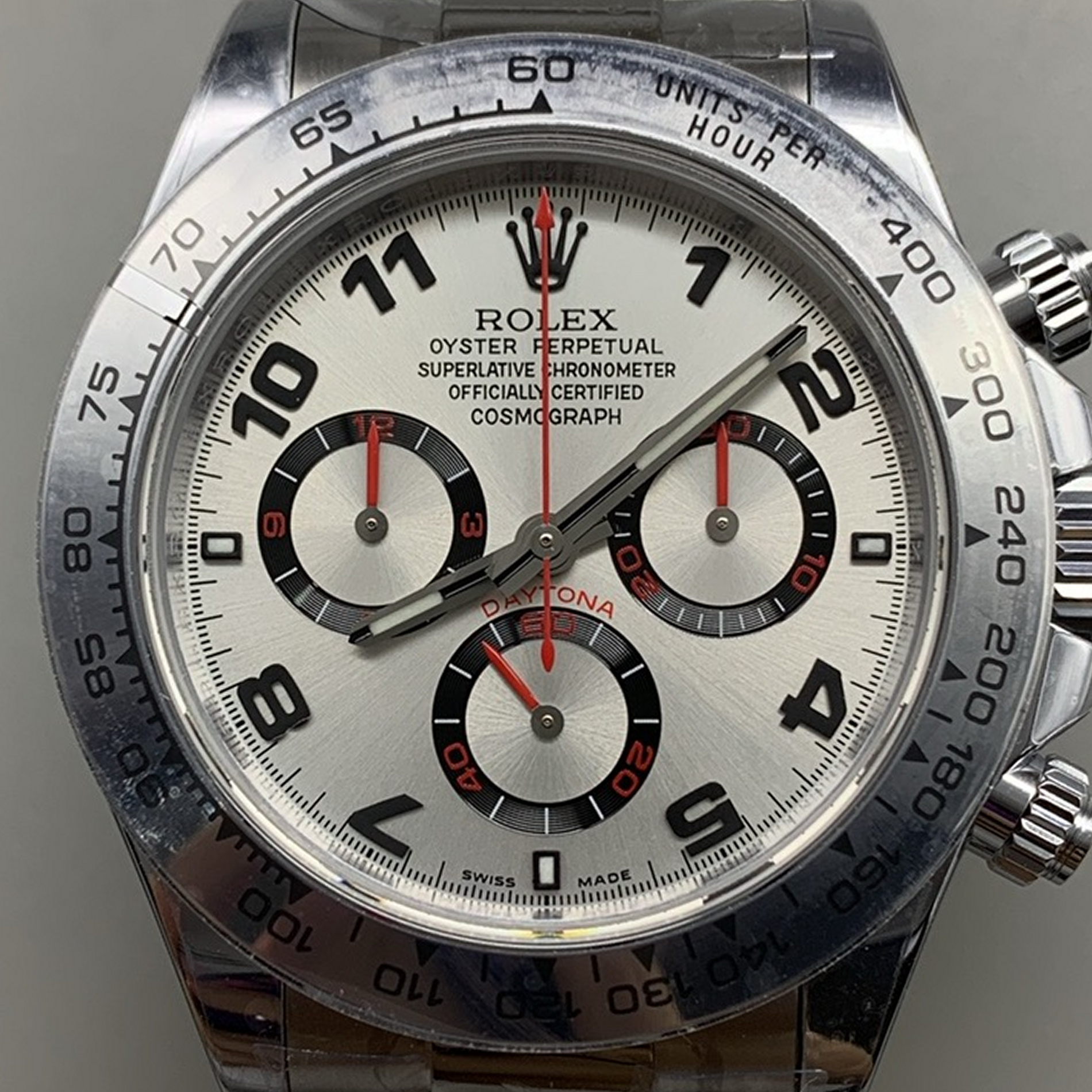 S001 · Camera geometry corrected. Image rotated approximately 0.4° clockwise at the dial centre; perspective and unequal image scaling normalized to a circular dial reference using isolated printed minute strokes. Recentered and resampled to 1900 × 1900 pixels. No correction for crystal refraction or raised bezel/hand geometry. Extended rays are visual dial references only; they do not correct or measure the raised bezel.