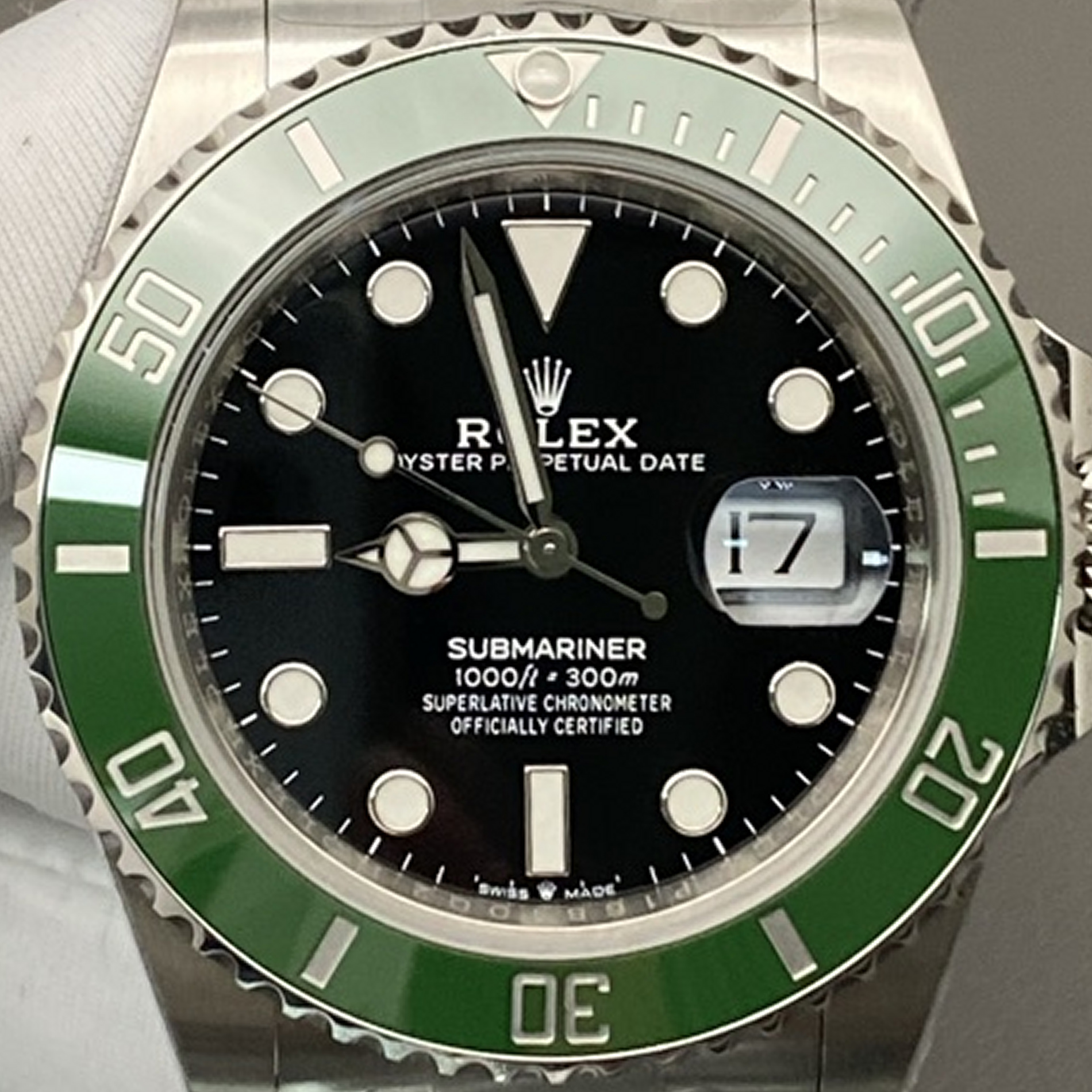 S001 · Camera geometry corrected. Image rotated approximately 1.0° clockwise at the dial centre; perspective and unequal image scaling normalized to a circular dial reference using isolated printed minute strokes. Recentered and resampled to 1900 × 1900 pixels. No correction for crystal refraction or raised bezel/hand geometry. Extended rays are visual dial references only; they do not correct or measure the raised bezel.