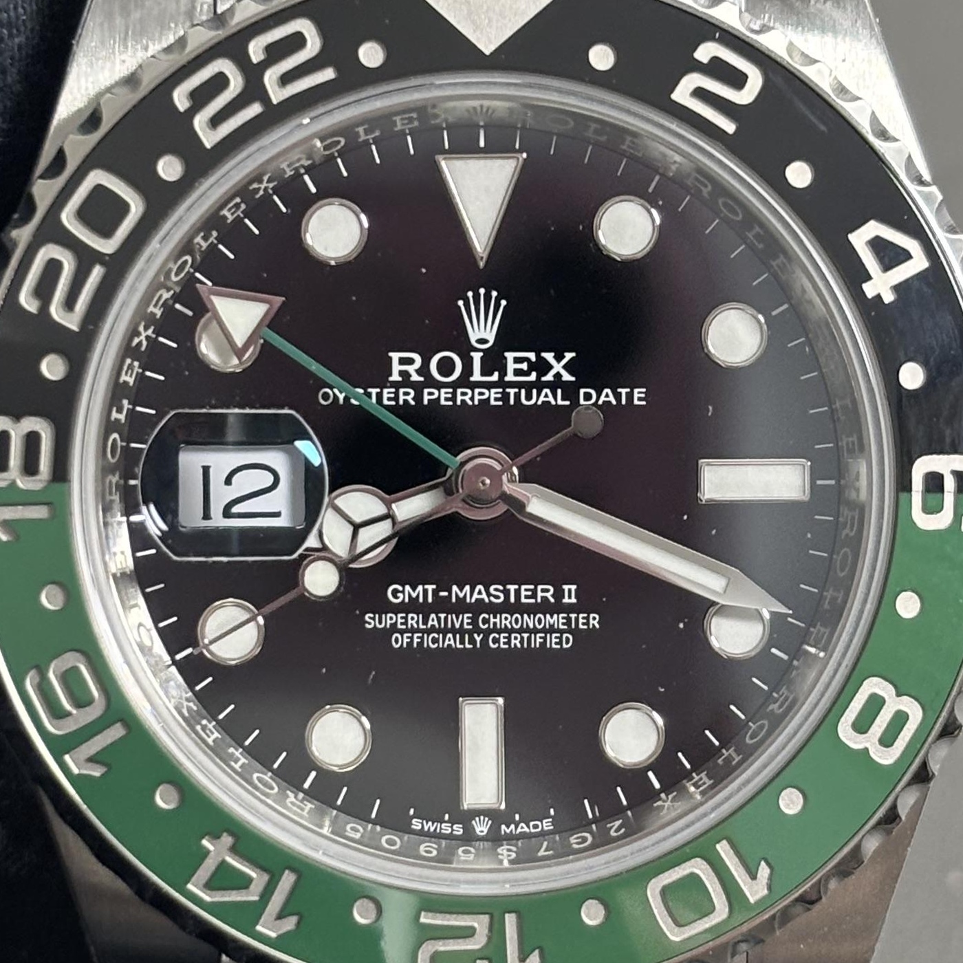 P12 · Camera geometry corrected. Image rotated approximately 0.0° counterclockwise at the dial centre; perspective and unequal image scaling normalized to a circular dial reference using the saved printed minute-track reference. Recentered and resampled to 1400 × 1400 pixels. No correction for crystal refraction or raised bezel/hand geometry.