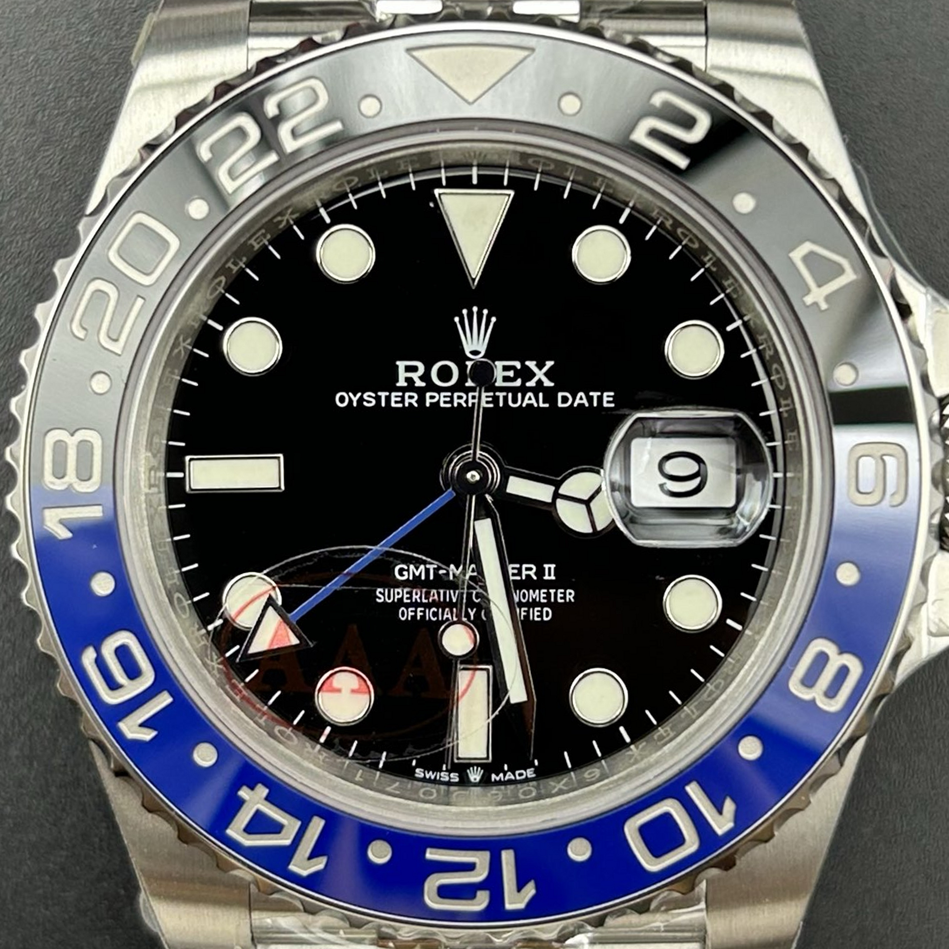 S004 · Camera geometry corrected. Image rotated approximately 0.9° counterclockwise at the dial centre; perspective and unequal image scaling normalized to a circular dial reference using isolated printed minute strokes. Recentered and resampled to 1900 × 1900 pixels. No correction for crystal refraction or raised bezel/hand geometry. Extended rays are visual dial references only; they do not correct or measure the raised bezel.