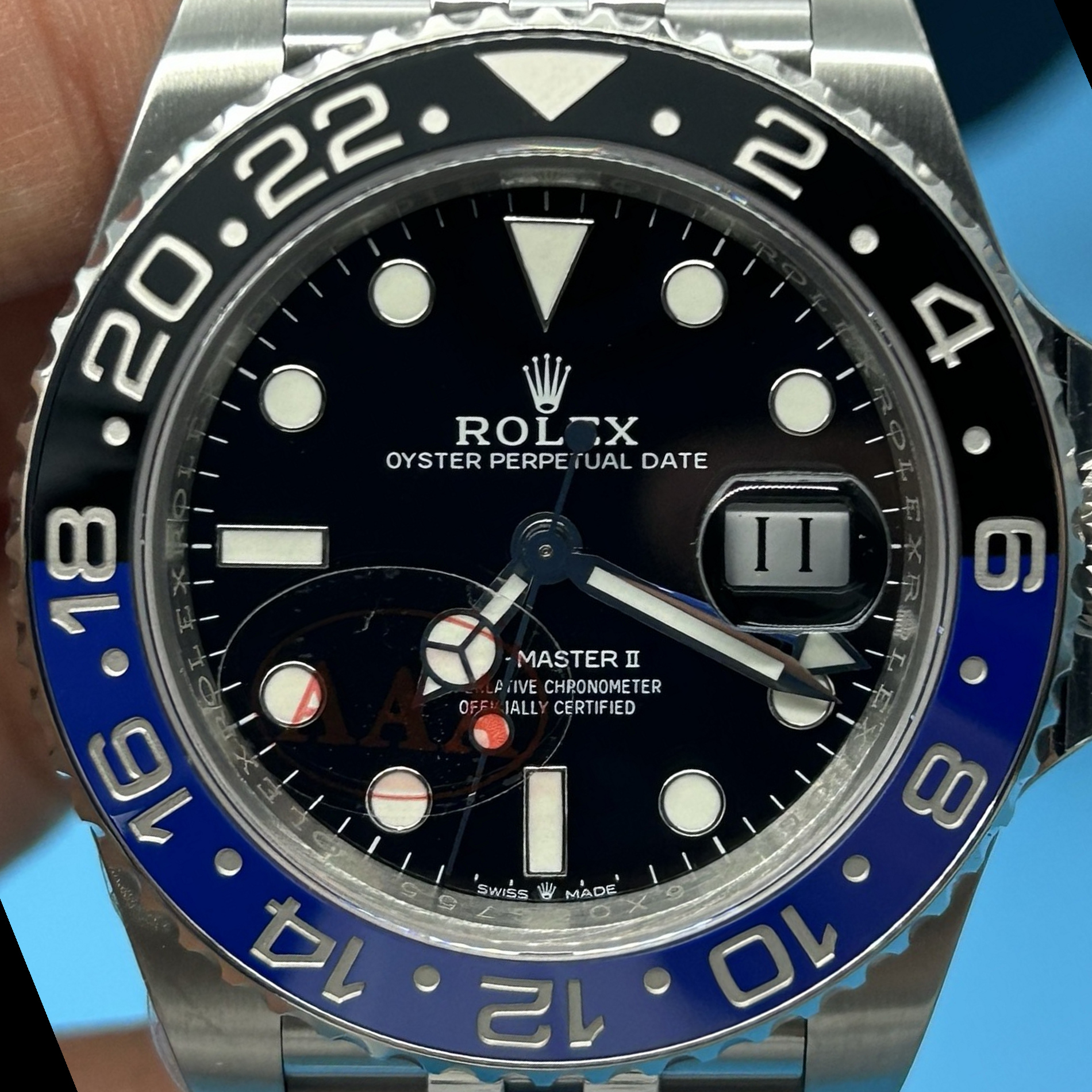S008 · Camera geometry corrected. Image rotated approximately 22.6° counterclockwise at the dial centre; perspective and unequal image scaling normalized to a circular dial reference using isolated printed minute strokes. Recentered and resampled to 1900 × 1900 pixels. No correction for crystal refraction or raised bezel/hand geometry. Extended rays are visual dial references only; they do not correct or measure the raised bezel.