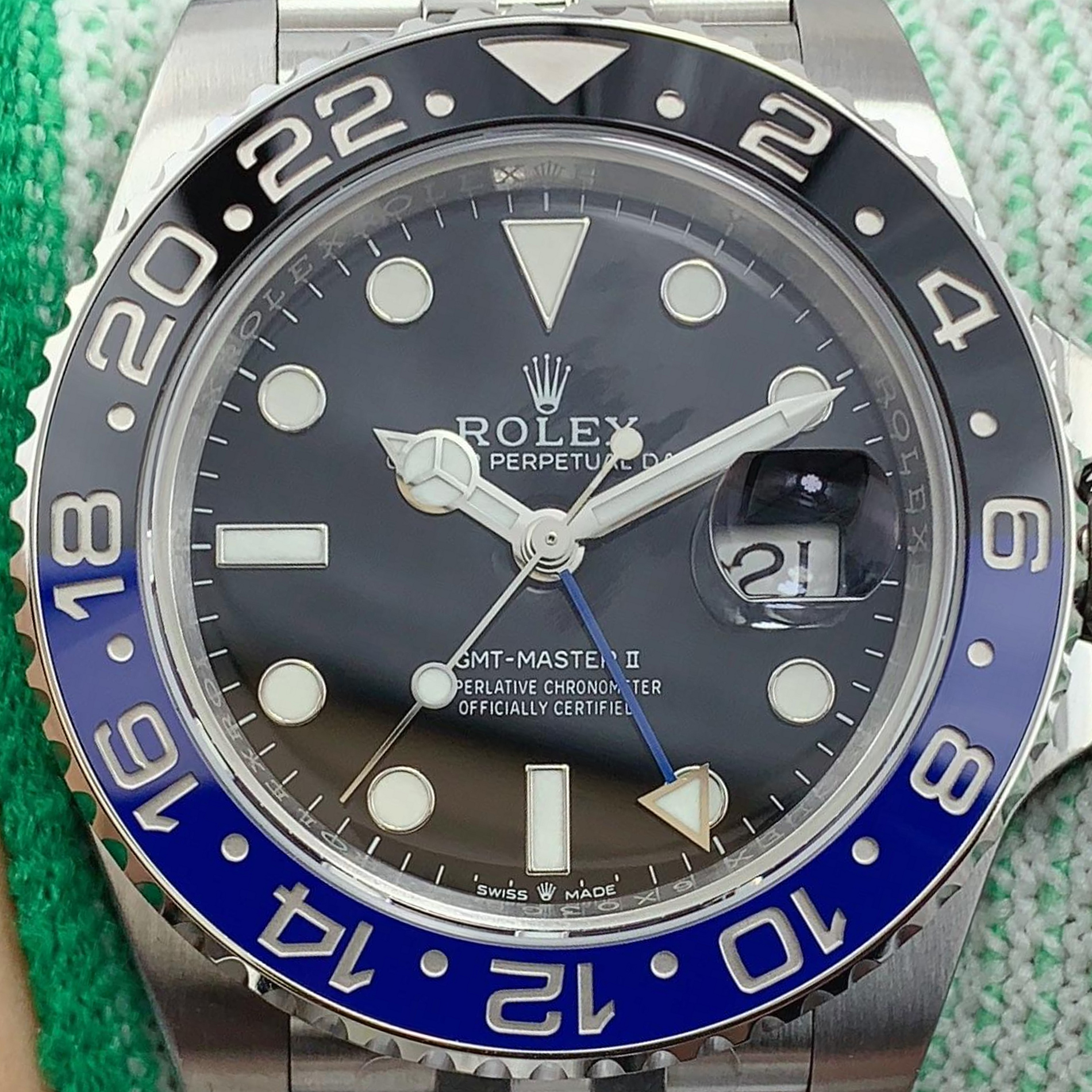 S011 · Camera geometry corrected. Image rotated approximately 13.7° clockwise at the dial centre; perspective and unequal image scaling normalized to a circular dial reference using isolated printed minute strokes. Recentered and resampled to 1900 × 1900 pixels. No correction for crystal refraction or raised bezel/hand geometry. Extended rays are visual dial references only; they do not correct or measure the raised bezel.