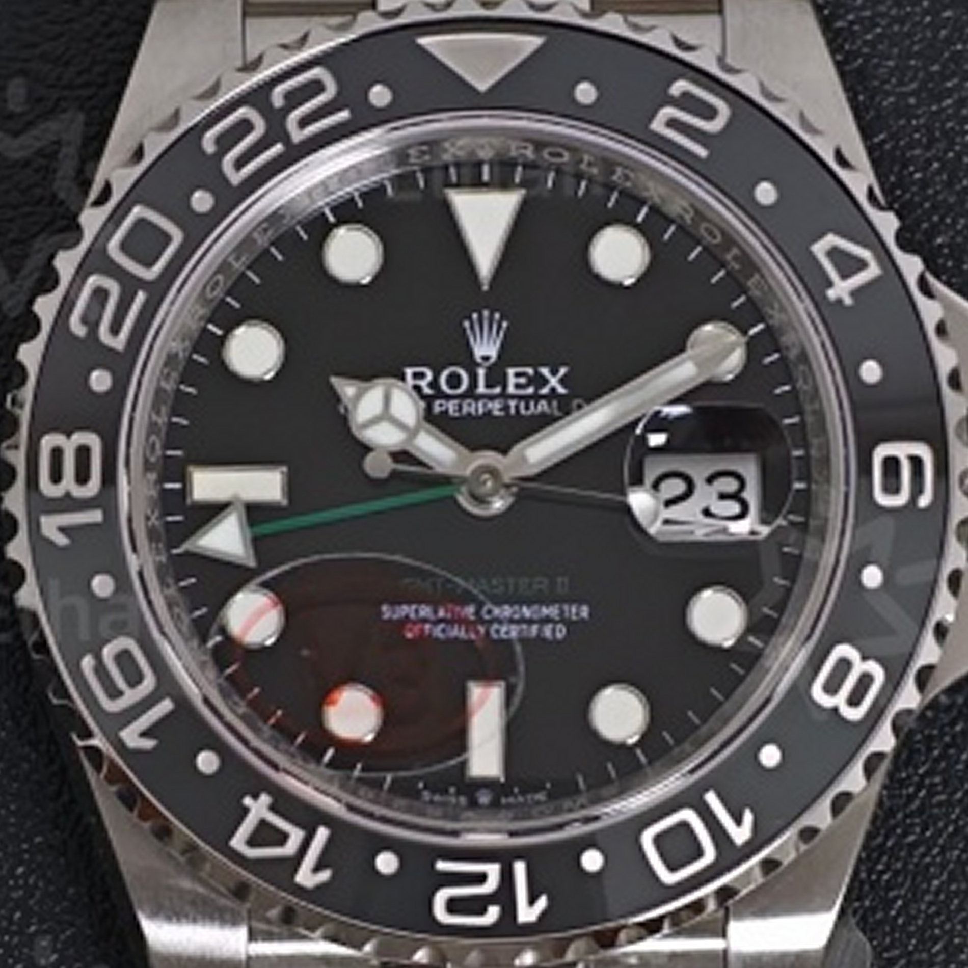 S001 · Camera geometry corrected. Image rotated approximately 1.6° counterclockwise at the dial centre; perspective and unequal image scaling normalized to a circular dial reference using the printed ticks’ inner tips after broad ink detection. Recentered and resampled to 1900 × 1900 pixels. No correction for crystal refraction or raised bezel/hand geometry. Extended rays are visual dial references only; they do not correct or measure the raised bezel.