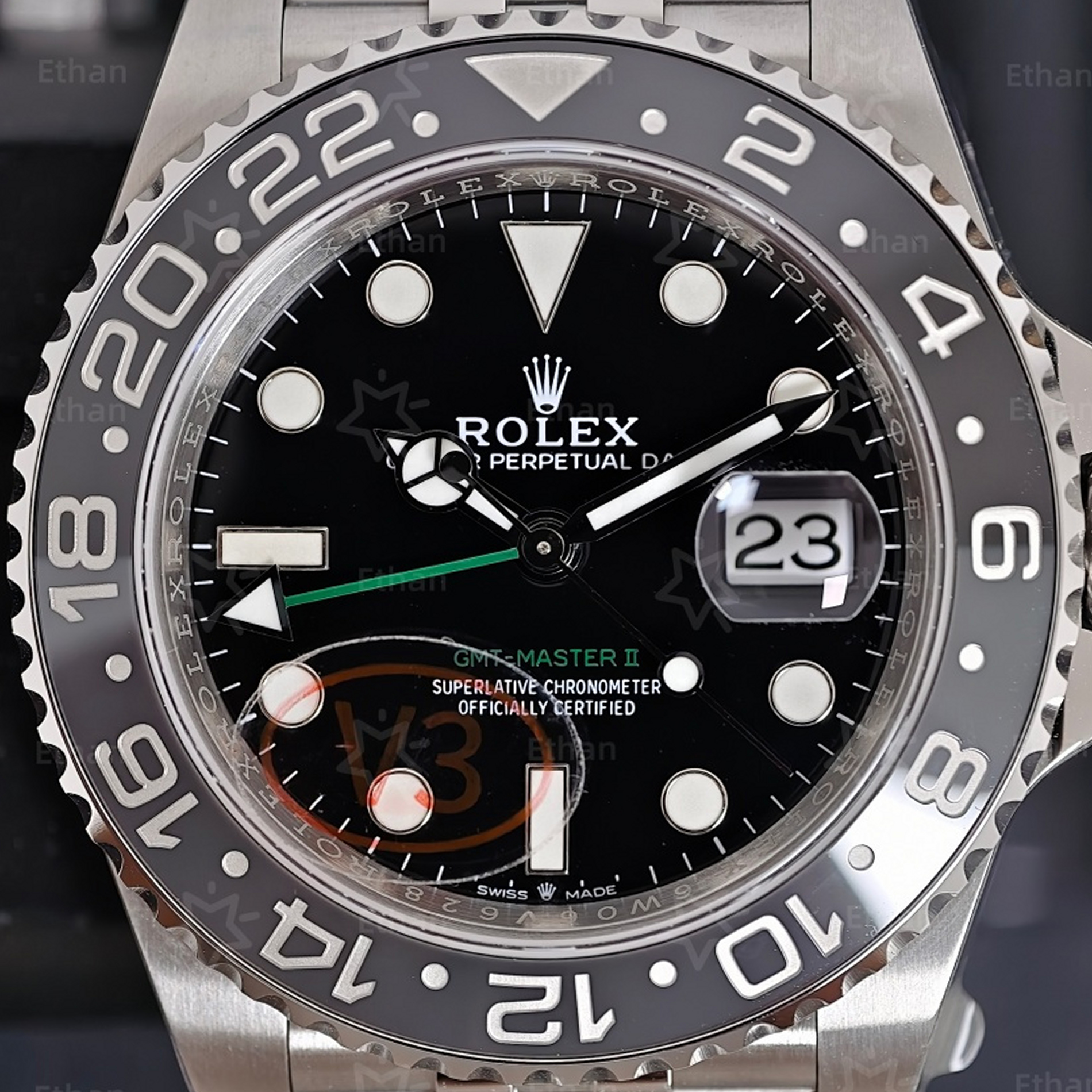 S002 · Camera geometry corrected. Image rotated approximately 0.2° counterclockwise at the dial centre; perspective and unequal image scaling normalized to a circular dial reference using isolated printed minute strokes. Recentered and resampled to 1900 × 1900 pixels. No correction for crystal refraction or raised bezel/hand geometry. Extended rays are visual dial references only; they do not correct or measure the raised bezel.